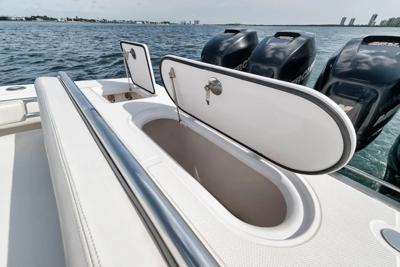  Yacht Photos Pics 2013 Bahama 41 boat with open storage compartment and powerful outboard engines.