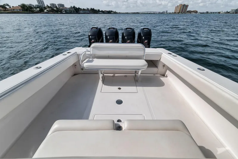  Yacht Photos Pics 2013 Bahama 41 boat with spacious deck and four powerful outboard engines on the water.