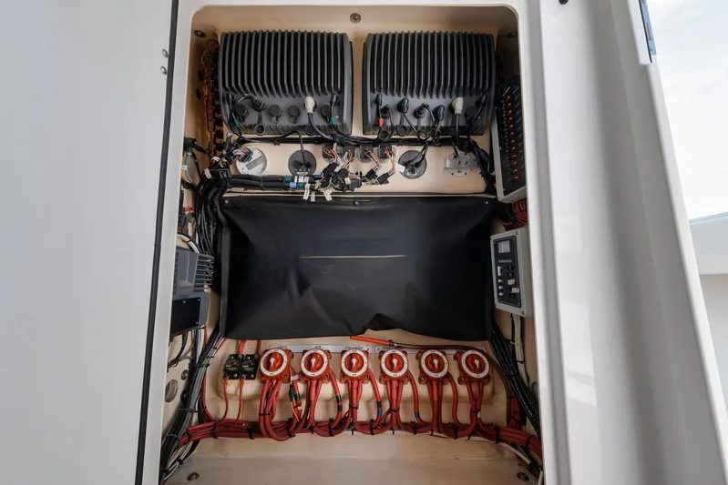  Yacht Photos Pics Electrical panel of a 2013 Bahama 41 boat, showcasing wiring and components.