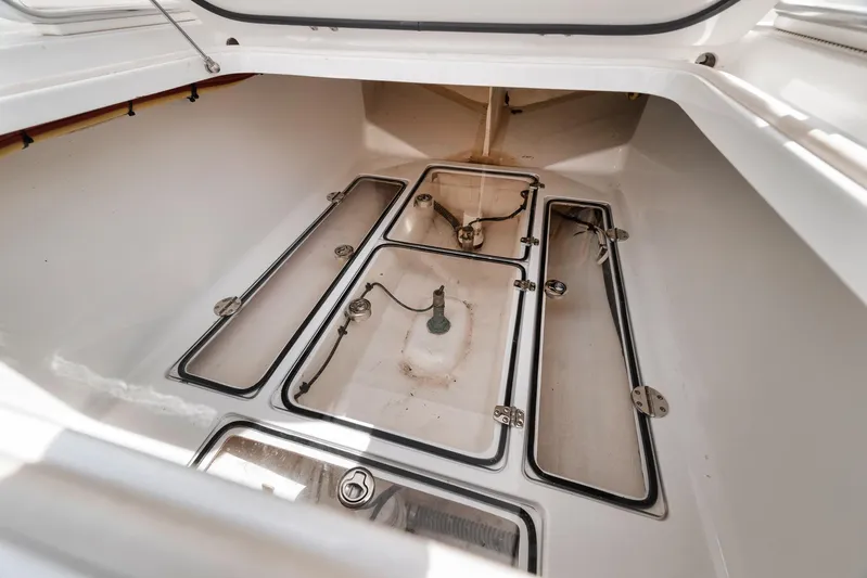  Yacht Photos Pics Storage compartment of a 2013 Bahama 41 boat, featuring multiple access panels.