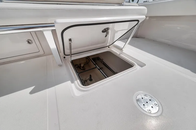  Yacht Photos Pics Open hatch on 2013 Bahama 41 boat deck, revealing storage compartment.