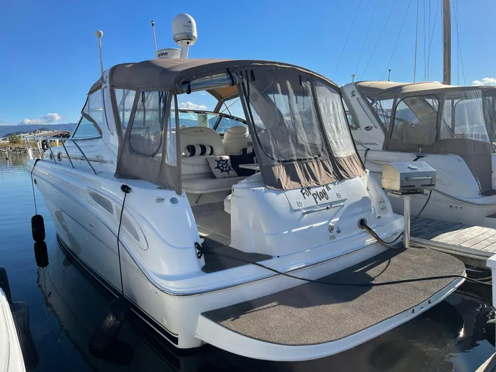  Yacht Photos Pics 2000 Sea Ray 380 Sundancer docked, featuring a spacious deck and covered seating area.