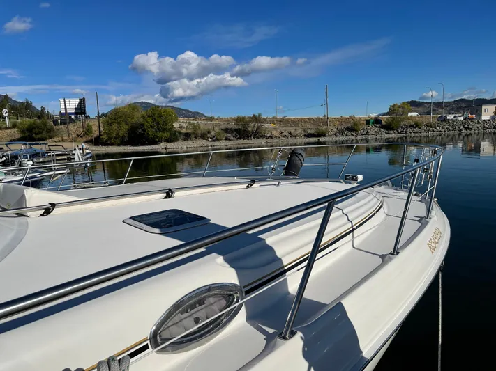  Yacht Photos Pics Sea Ray 380 Sundancer 2000 model docked on a sunny day with clear blue skies.