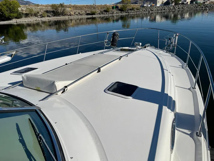  Yacht Photos Pics 2000 Sea Ray 380 Sundancer yacht on calm water, showcasing sleek deck design.