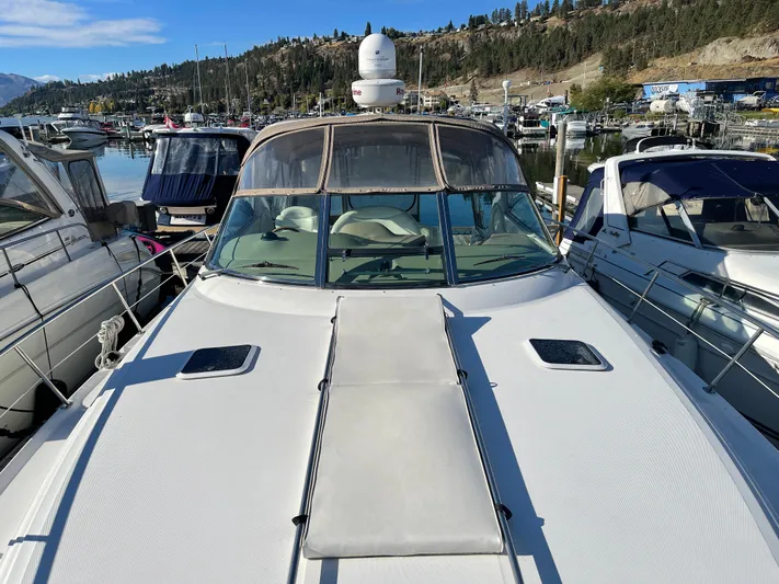  Yacht Photos Pics Sea Ray 380 Sundancer 2000 docked at marina with scenic hillside backdrop.