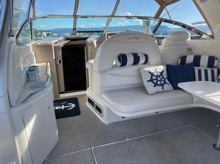  Yacht Photos Pics Interior of 2000 Sea Ray 380 Sundancer yacht with nautical-themed decor and seating.