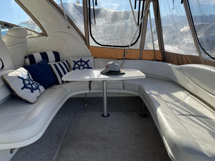  Yacht Photos Pics Luxurious interior of 2000 Sea Ray 380 Sundancer with plush seating and nautical decor.
