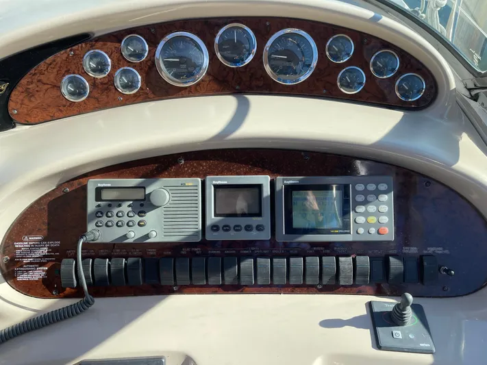  Yacht Photos Pics Control panel of a 2000 Sea Ray 380 Sundancer boat with gauges and navigation equipment.