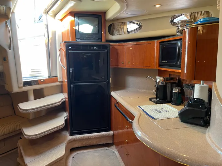  Yacht Photos Pics Interior of 2000 Sea Ray 380 Sundancer yacht with kitchen and stairs.
