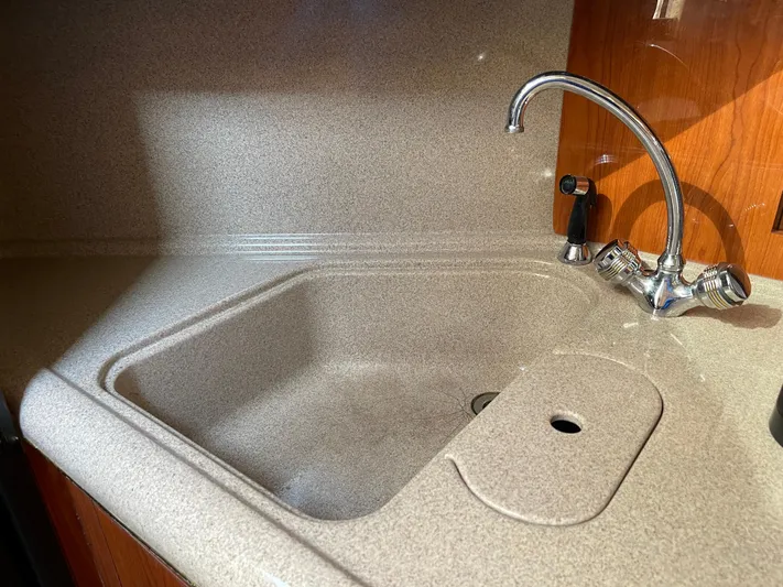  Yacht Photos Pics Kitchen sink area in a 2000 Sea Ray 380 Sundancer boat.