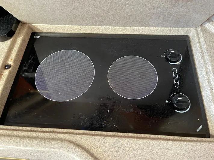  Yacht Photos Pics Stovetop on 2000 Sea Ray 380 Sundancer yacht, featuring two burners and control knobs.