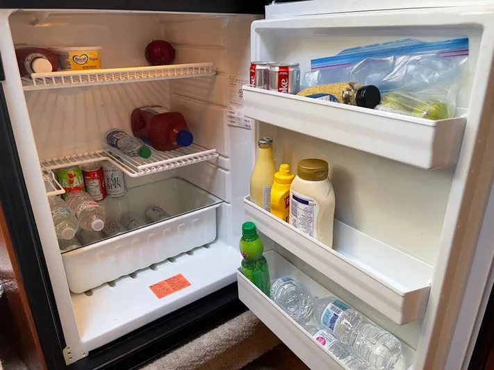  Yacht Photos Pics Mini fridge stocked with drinks and condiments on a 2000 Sea Ray 380 Sundancer boat.