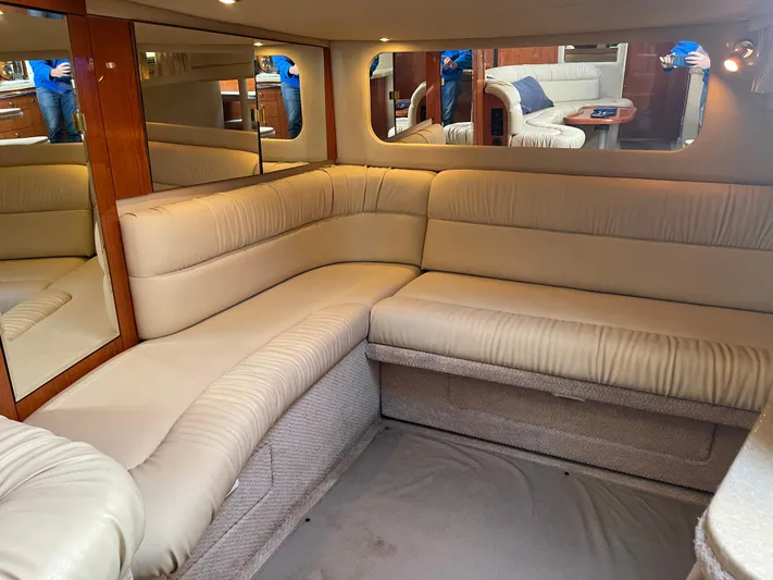  Yacht Photos Pics Interior of 2000 Sea Ray 380 Sundancer with beige leather seating and mirrored walls.