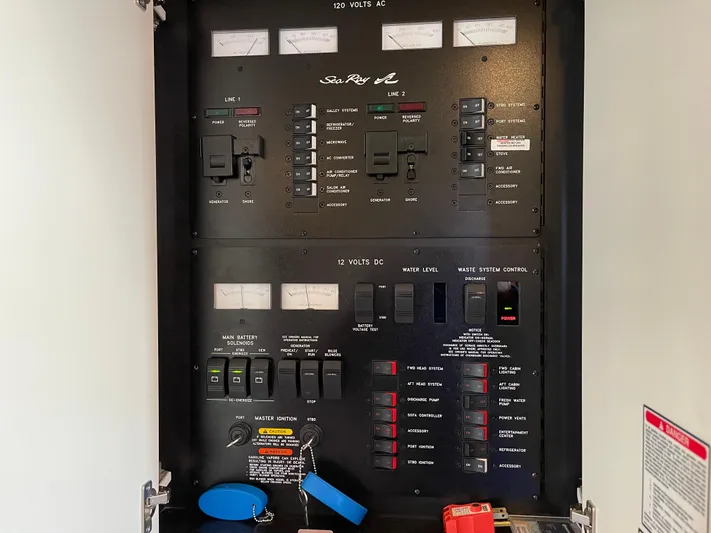  Yacht Photos Pics Electrical panel of a 2000 Sea Ray 380 Sundancer boat, showing switches and meters.