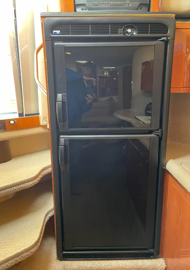  Yacht Photos Pics Black refrigerator inside 2000 Sea Ray 380 Sundancer yacht cabin.