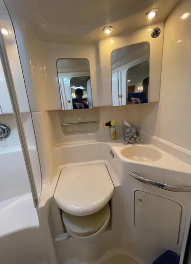  Yacht Photos Pics Bathroom interior of 2000 Sea Ray 380 Sundancer yacht, featuring toilet and sink.