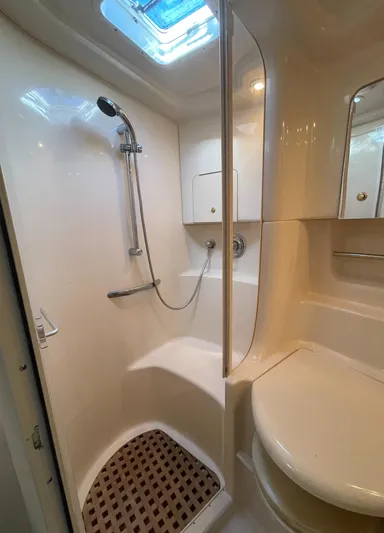 Yacht Photos Pics 2000 Sea Ray 380 Sundancer bathroom with shower, skylight, and modern fixtures.