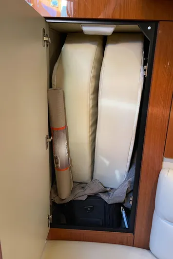  Yacht Photos Pics Storage compartment in a 2000 Sea Ray 380 Sundancer yacht with cushions and rolled mat.
