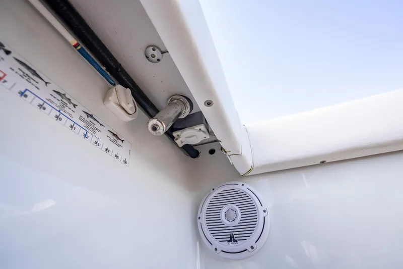  Yacht Photos Pics Interior view of a 2019 Freeman 42LR boat, featuring a speaker and measurement guide.