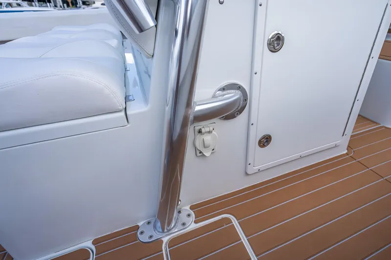  Yacht Photos Pics 2019 Freeman 42LR boat interior with white seating and stainless steel railing.