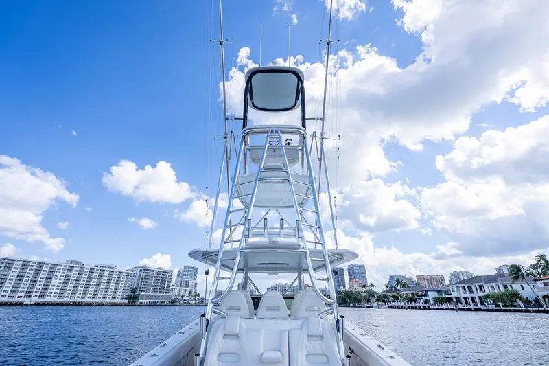  Yacht Photos Pics 2019 Freeman 42LR boat on water, clear sky, cityscape background.