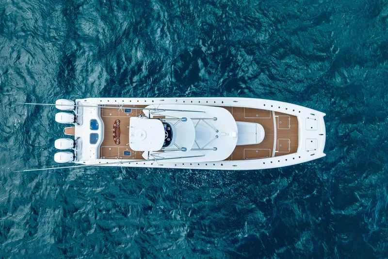  Yacht Photos Pics Aerial view of 2019 Freeman 42LR boat on blue ocean water.
