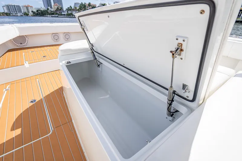  Yacht Photos Pics Open storage compartment on 2019 Freeman 42LR boat with teak deck.