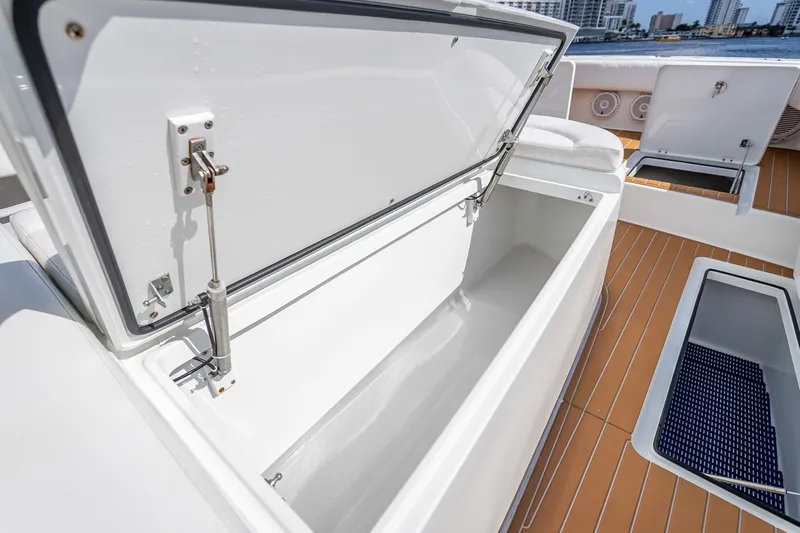  Yacht Photos Pics Open storage compartment on 2019 Freeman 42LR boat deck, showcasing spacious interior.