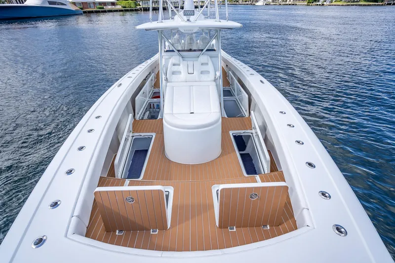  Yacht Photos Pics 2019 Freeman 42LR boat with spacious deck and storage, cruising on calm waters.