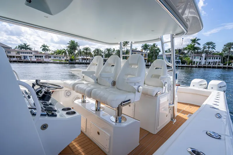  Yacht Photos Pics Luxurious 2019 Freeman 42LR boat interior with plush seating and scenic waterfront view.