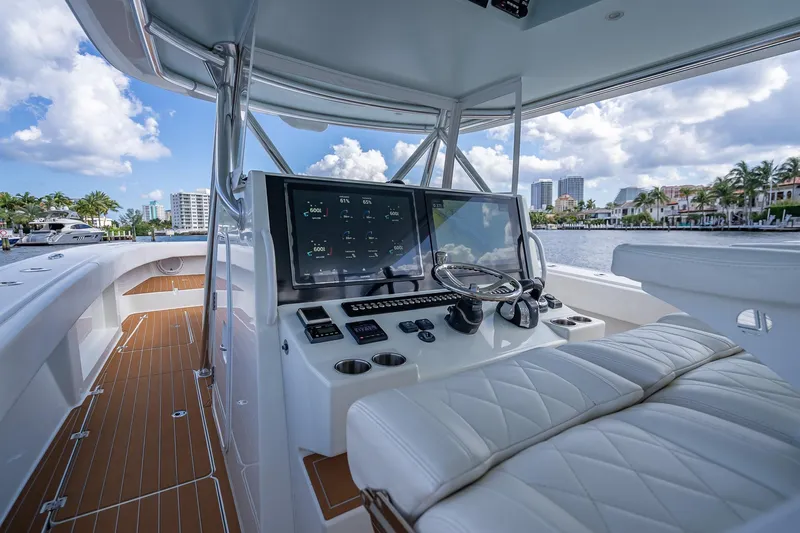  Yacht Photos Pics 2019 Freeman 42LR boat interior with modern dashboard and waterfront view.