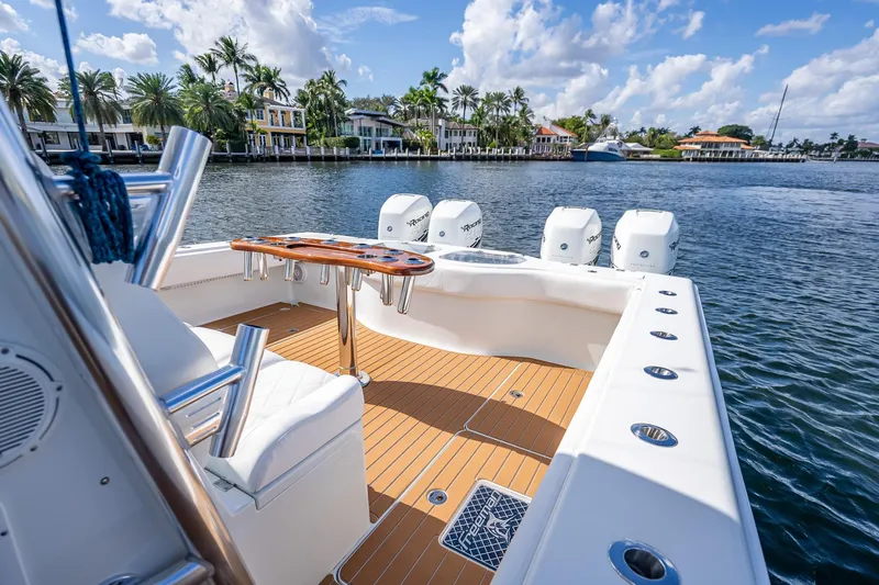  Yacht Photos Pics Luxurious 2019 Freeman 42LR boat with sleek deck and powerful engines on scenic waterway.