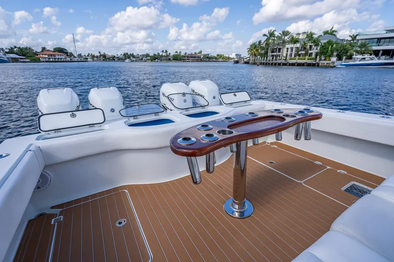  Yacht Photos Pics Luxury Freeman 42LR boat interior with fishing rod holders, docked by waterfront homes, 2019 model.