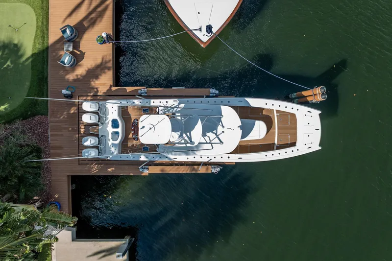  Yacht Photos Pics Aerial view of a 2019 Freeman 42LR boat docked at a wooden pier.