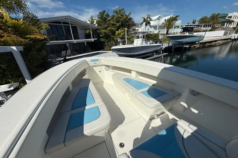  Yacht Photos Pics 2019 SeaVee 340Z boat docked, featuring spacious seating and modern design.