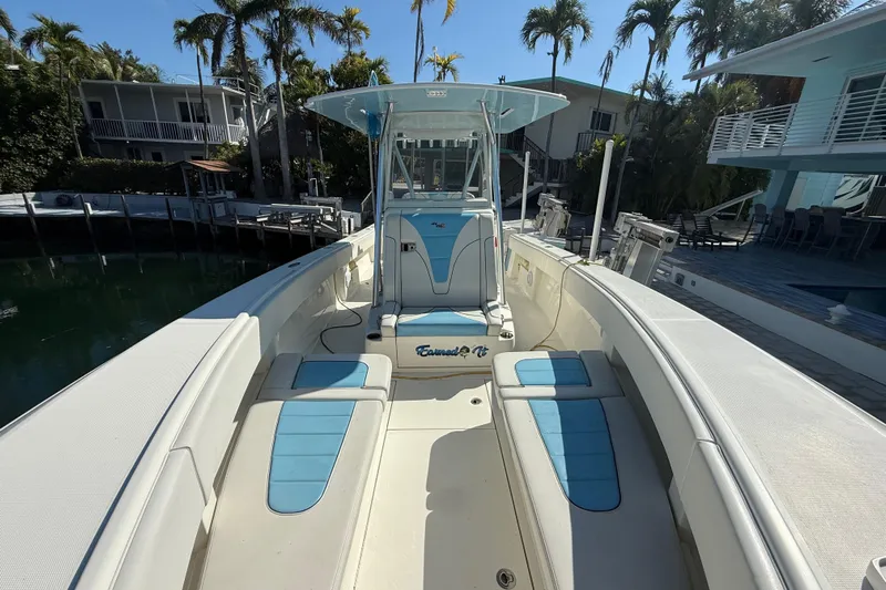  Yacht Photos Pics 2019 SeaVee 340Z boat with blue and white seating, docked near palm trees.