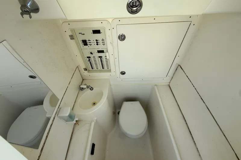  Yacht Photos Pics 2019 SeaVee 340Z boat interior with toilet, sink, and control panel.