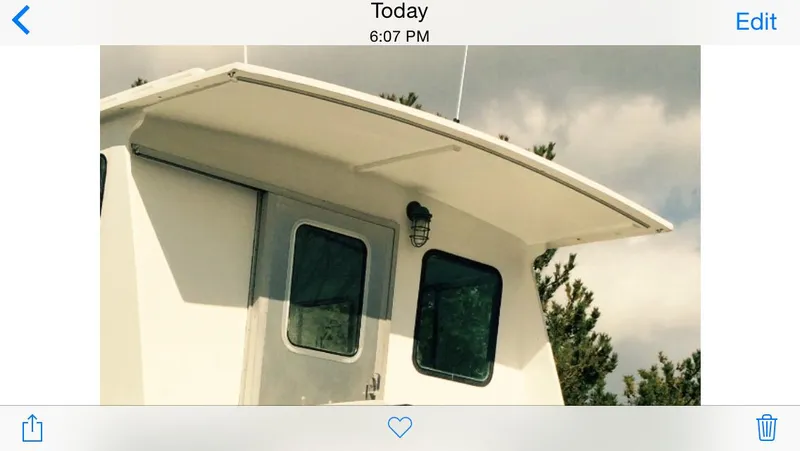  Yacht Photos Pics 2002 Northern Bay Fisherman/Cruiser boat cabin with windows and light fixture.