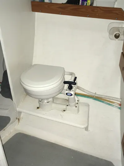  Yacht Photos Pics 2002 Northern Bay Fisherman/Cruiser boat bathroom with compact marine toilet.