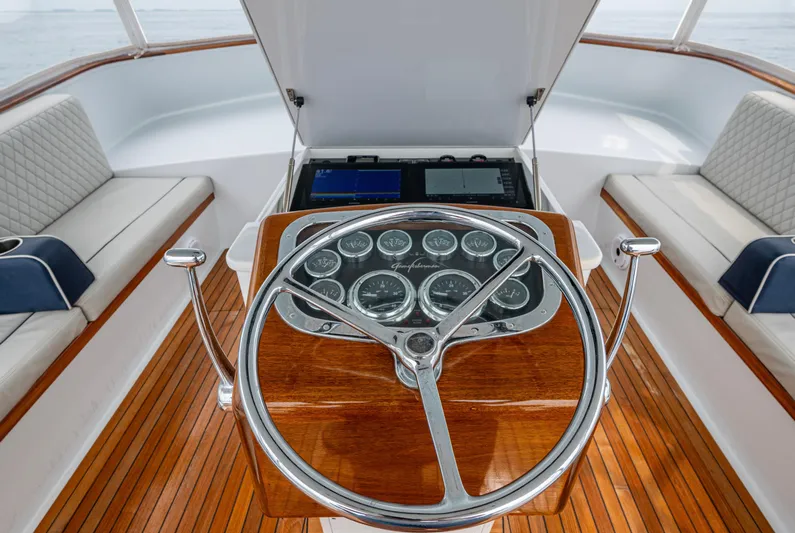 Slippery Slope Yacht Photos Pics Helm of 2005 Gamefisherman 45 Express boat with wooden dashboard and gauges.