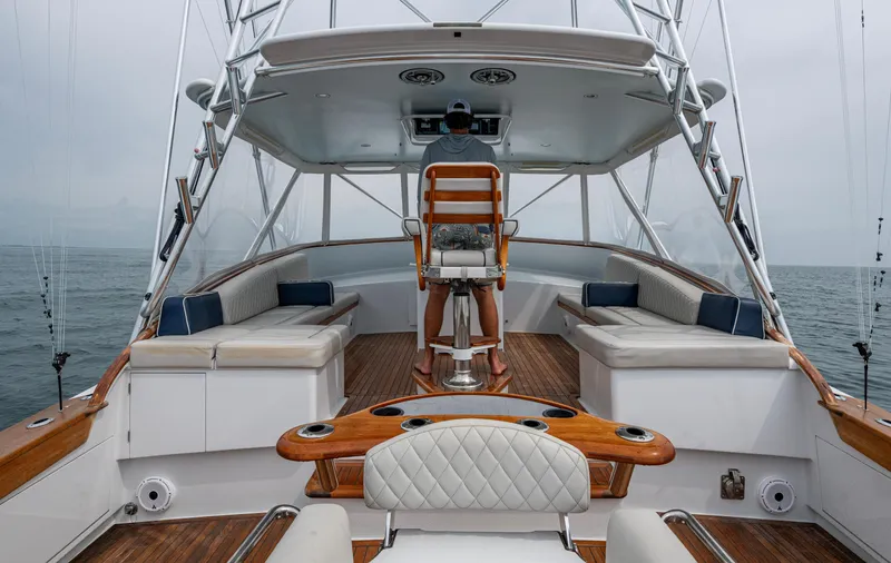 Slippery Slope Yacht Photos Pics 2005 Gamefisherman 45 Express yacht interior with helm, seating, and ocean view.