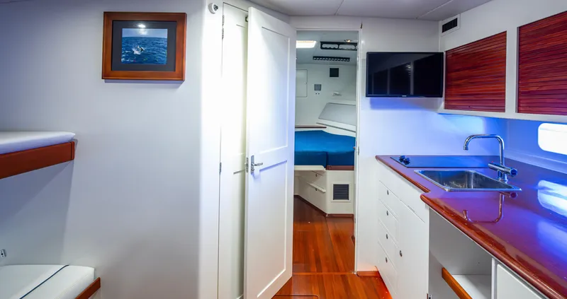 Slippery Slope Yacht Photos Pics Interior of 2005 Gamefisherman 45 Express yacht with modern kitchen and cozy cabin.