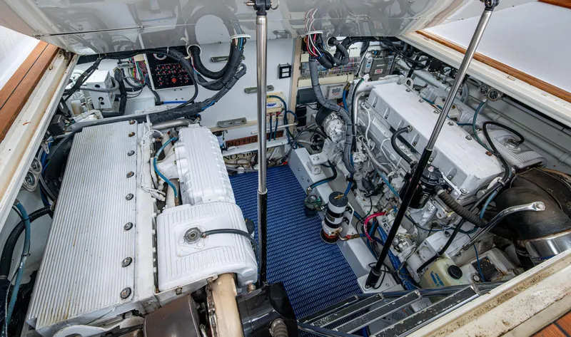 Slippery Slope Yacht Photos Pics Engine room of 2005 Gamefisherman 45 Express, showcasing dual engines and mechanical components.