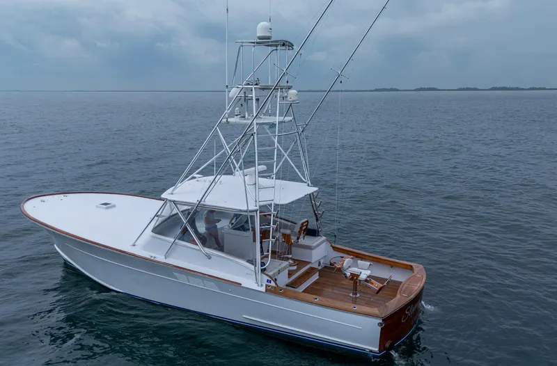 Slippery Slope Yacht Photos Pics 2005 Gamefisherman 45 Express boat on open water, featuring sleek design and fishing equipment.