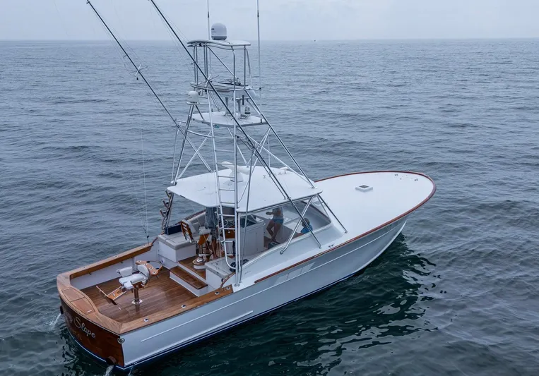 Slippery Slope Yacht Photos Pics 2005 Gamefisherman 45 Express boat on open water, featuring a sleek design and fishing equipment.