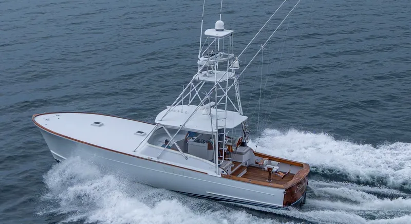 Slippery Slope Yacht Photos Pics 2005 Gamefisherman 45 Express yacht cruising on open water.