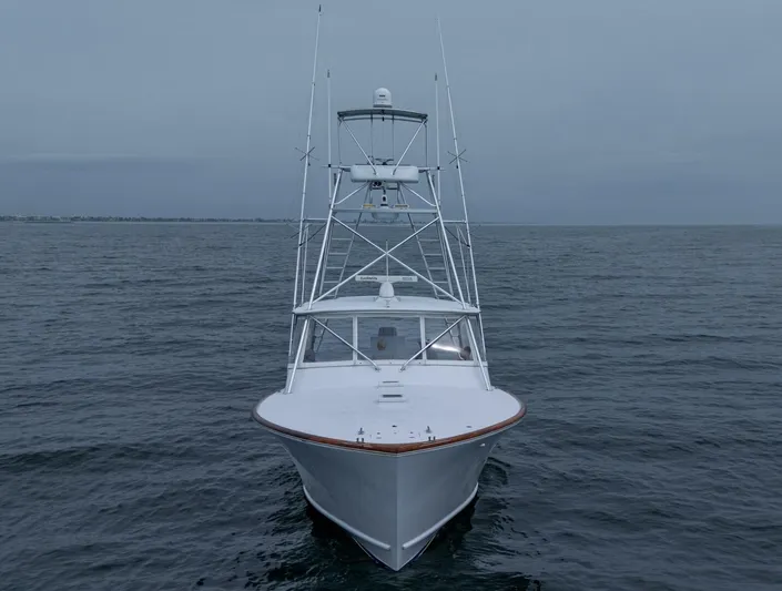 Slippery Slope Yacht Photos Pics 2005 Gamefisherman 45 Express boat on open sea, front view.