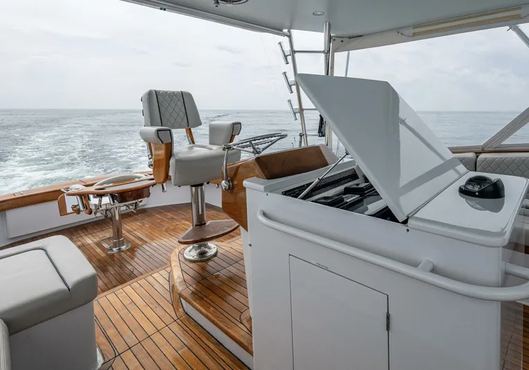 Slippery Slope Yacht Photos Pics 2005 Gamefisherman 45 Express yacht interior with wooden deck and fishing chair.