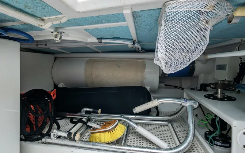 Slippery Slope Yacht Photos Pics Storage area of 2005 Gamefisherman 45 Express boat with cleaning tools and equipment.