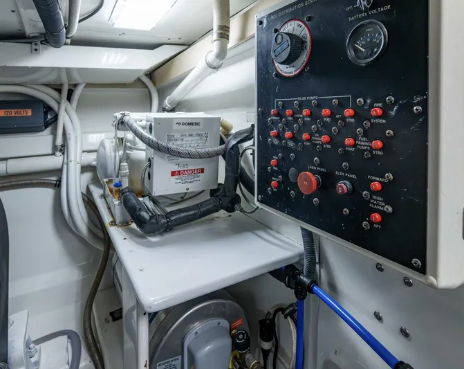 Slippery Slope Yacht Photos Pics Engine room of 2005 Gamefisherman 45 Express with control panel and equipment.